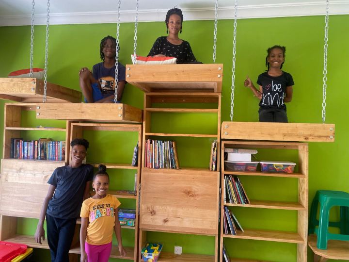 Learners choosing books in the reading corner